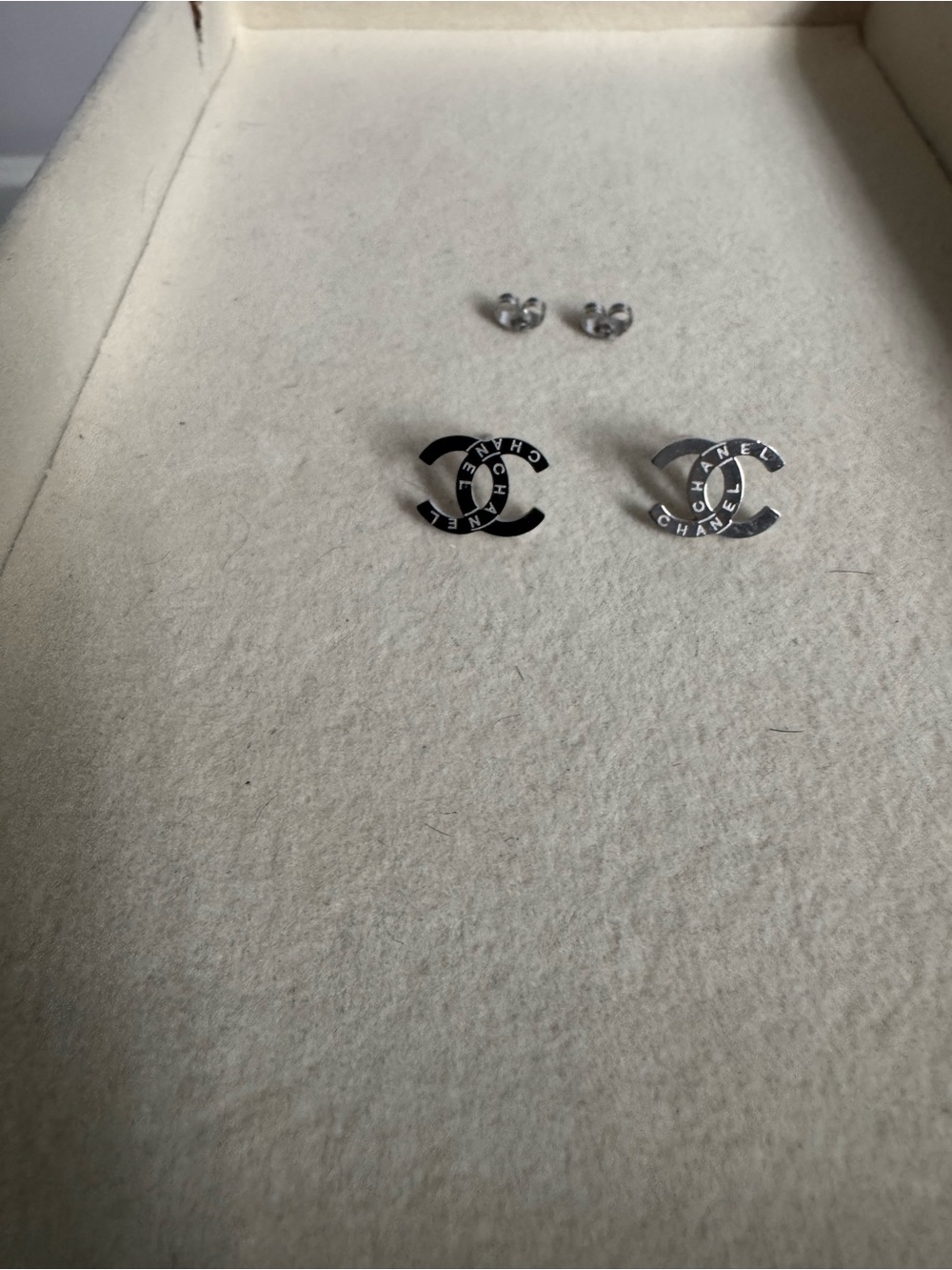 Silver tiny studs with detailed writing